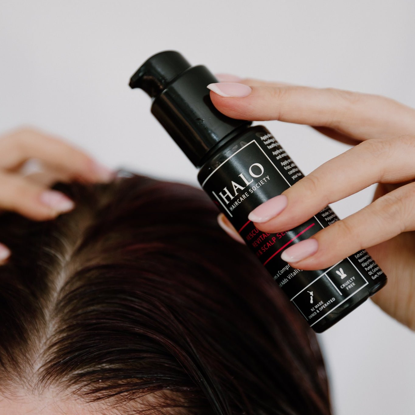 Brunette using Halo Haircare Scalp Serum